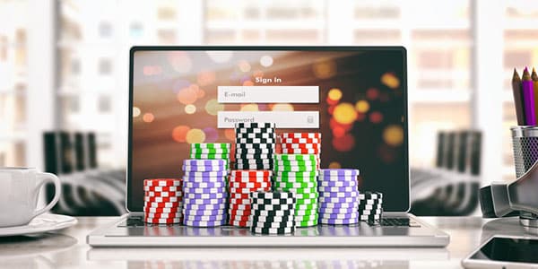 Online Casino chips and laptop